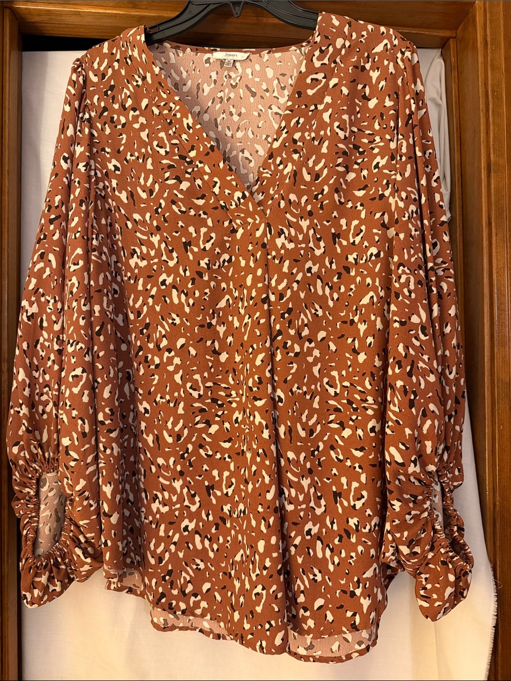 JODIFL Rust Animal-Print V-Neck Blouse with Ruched Cuffs